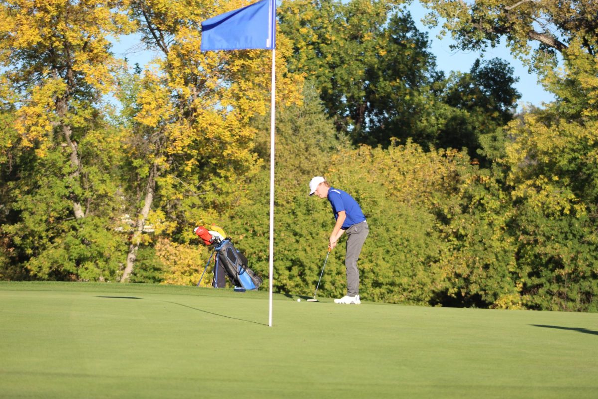 Osten Fromm putts for par at Meadowbrook.
