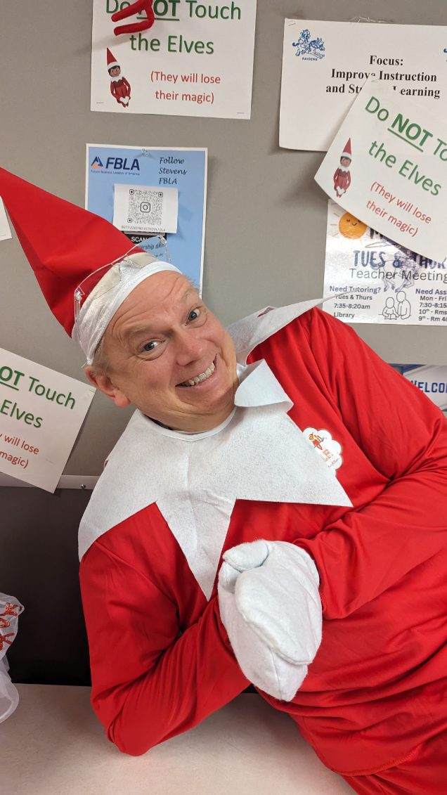 Mr.+Guymon+dressed+as+the+Elf+on+the+Shelf+to+bring+holiday+cheer+to+the+students.