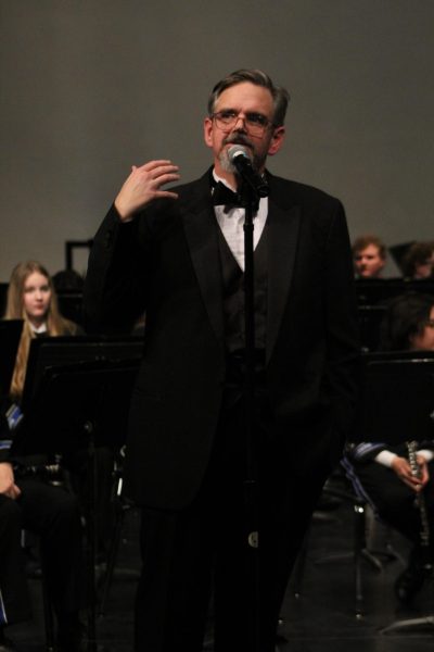 Band Director George Dragoo talked with the audience at a concert last year. 