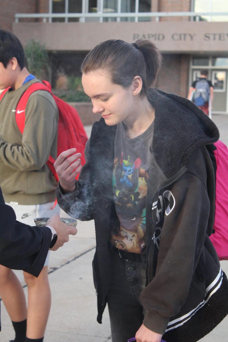 Junior Esther Mandy takes a moment to reflect and participate in Azylia offered by Stevens staff.