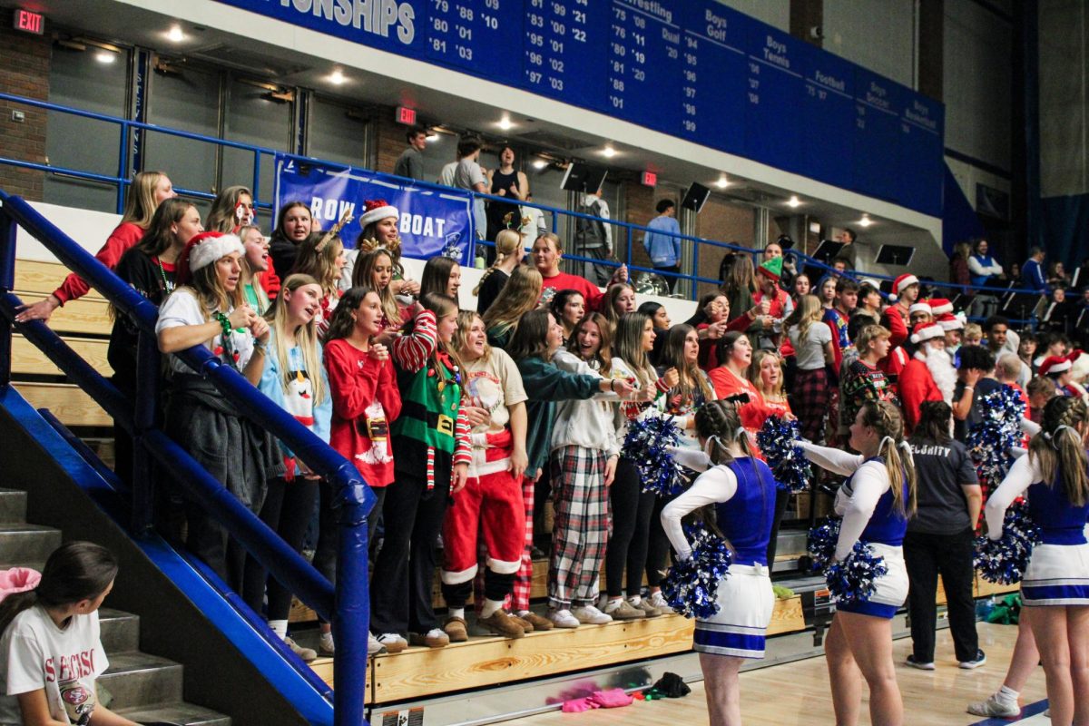 The student section celebrates the holidays art the boys basketball game in December. 