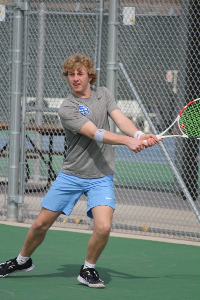 With his backhand in full force, Max Phares volleys one back at Sioux Park.
