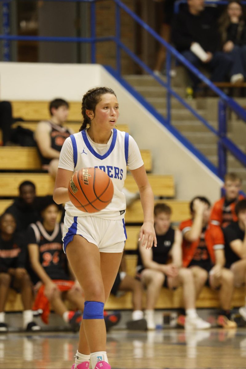 Senior guard Finley Love brings the ball down the court against Sioux Falls Washington. 