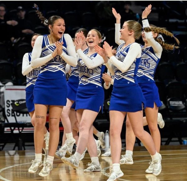 Raiders cheerleaders react to winning their 4th Spirit of Six.